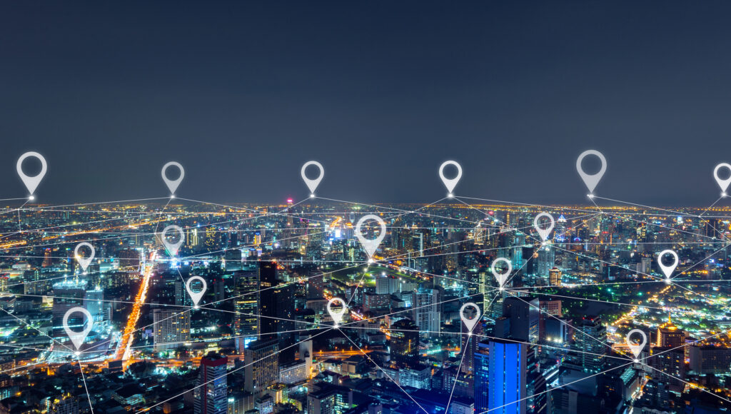 Map pin flat of city, network connection lines in Bangkok Downtown, Thailand. Financial district and business center in smart urban city in Asia. Skyscraper and high-rise buildings at night